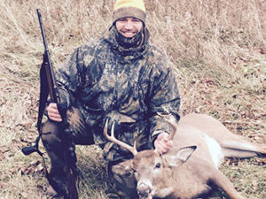 Chris smiling after snagging a Deer