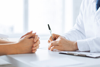 Eye Doctor discussing LASIK with a patient