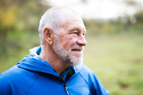 older man in blue jacket