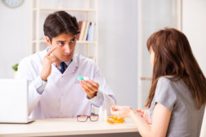 eye doctor and patient during eye exam
