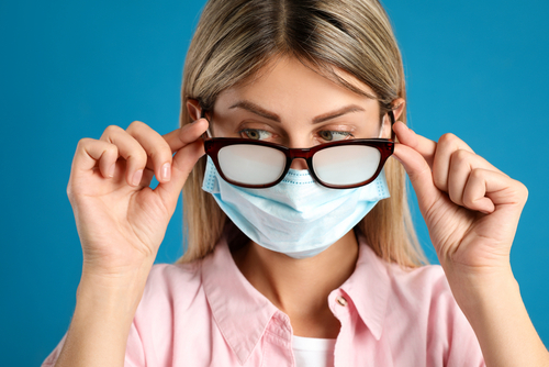 woman in mask and glasses