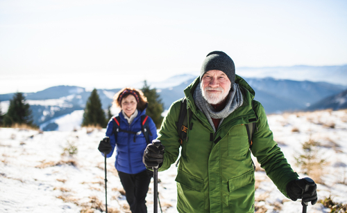 older man and woman hiking 