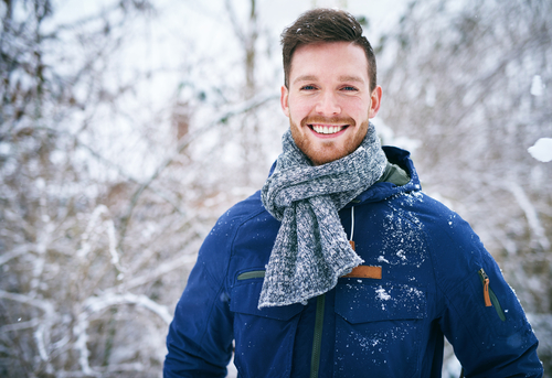 Man outdoors with a smile on his face